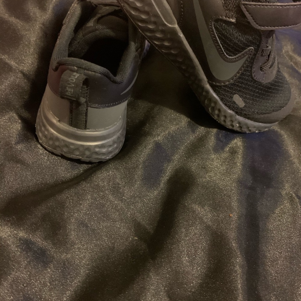Little boy black running shoe